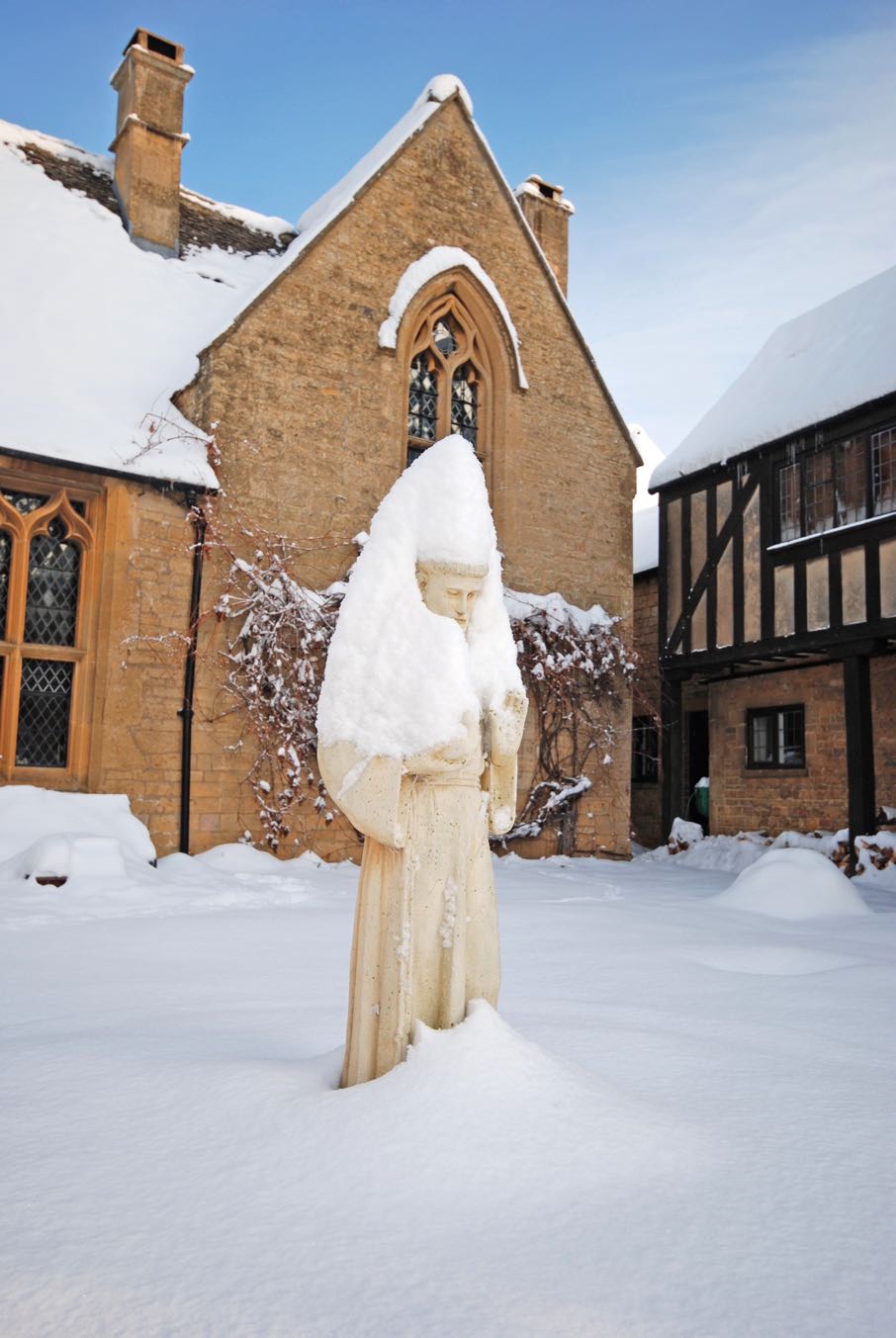 Abbots sculpture and courtyard covered in snow